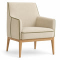 Sillón de tela beige con patas de madera de roble